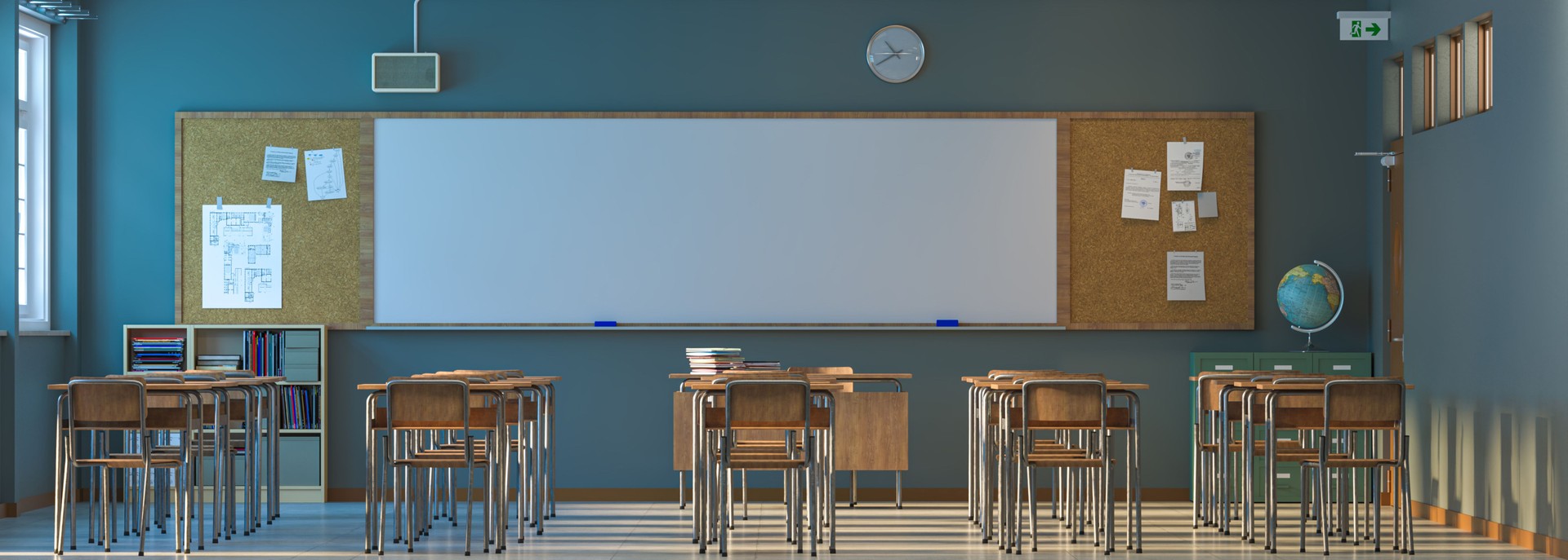 Deserted classroom with whiteboard and wooden desks